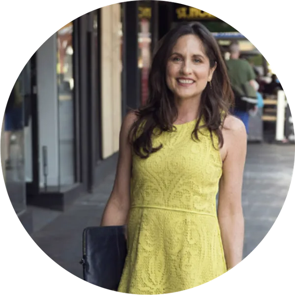 Sarah Gale in a yellow dress on a Melbourne street